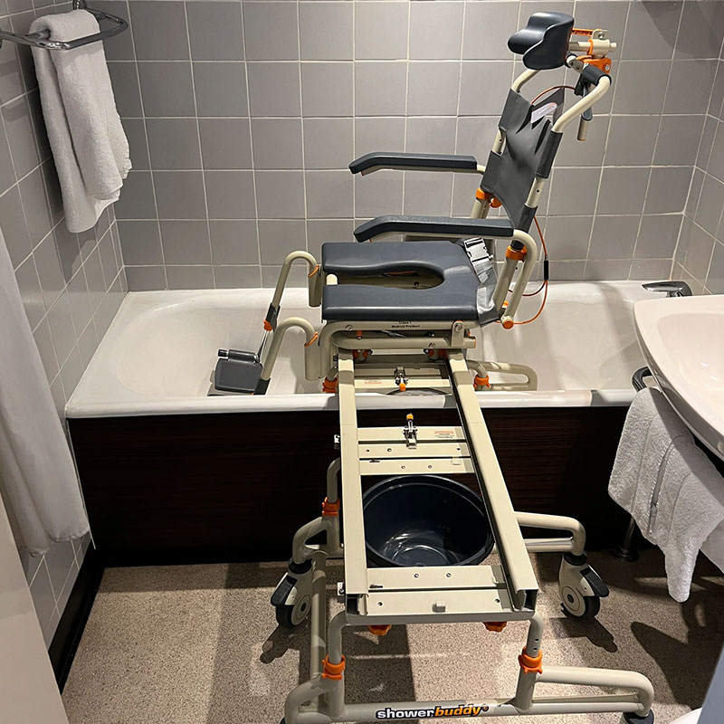 TubBuddy Tilt SB2T Shower chair positioned over bathtub TubBuddy Tilt SB2T Shower chair positioned over bathtub